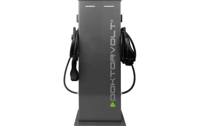Freestanding EV charging station Doktorvolt® 2×22 kW with two integrated Type 2 charging cables for simultaneous charging of two electric vehicles.